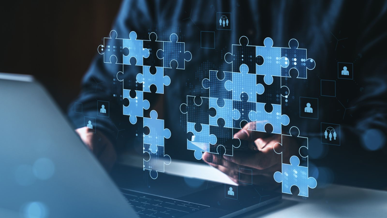 Digital teamwork scene with puzzle pieces, representing metadata alignment across localization systems